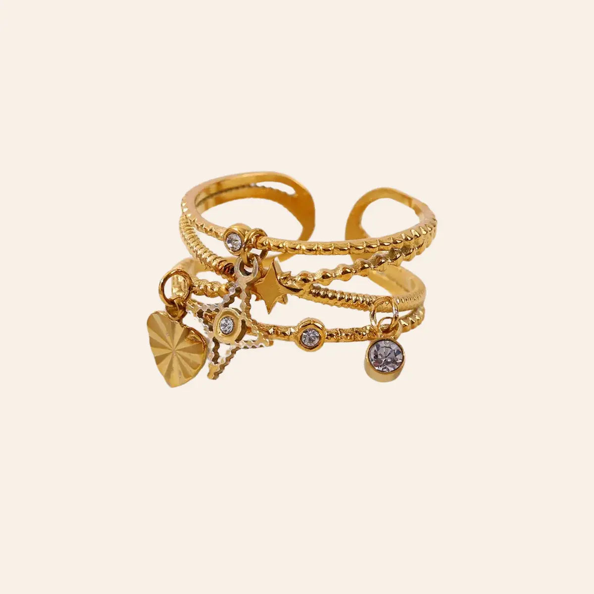 Bague Antalya en acier inoxydable doré ornée de petits pendentifs et d'oxydes de zirconium, design élégant et moderne.