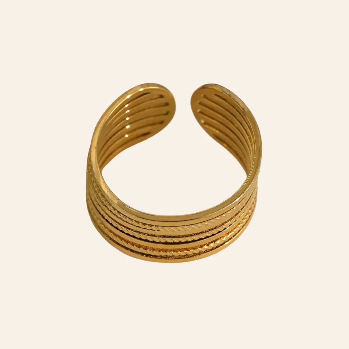 Bague Lagos en acier inoxydable doré, design épuré et moderne.