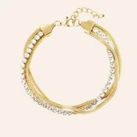 Bracelet Brasilia en acier inoxydable doré, chaîne délicate ornée de cristaux étincelants, présenté seul sur fond neutre.