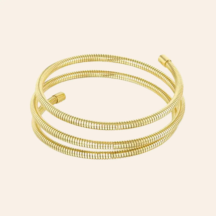 Bracelet Istanbul en acier inoxydable doré, design en spirale élégant, présenté seul sur fond neutre.