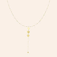 Collier Buenos Aires en acier inoxydable doré, cœurs délicats suspendus, design romantique et raffiné, présenté seul sur fond neutre.