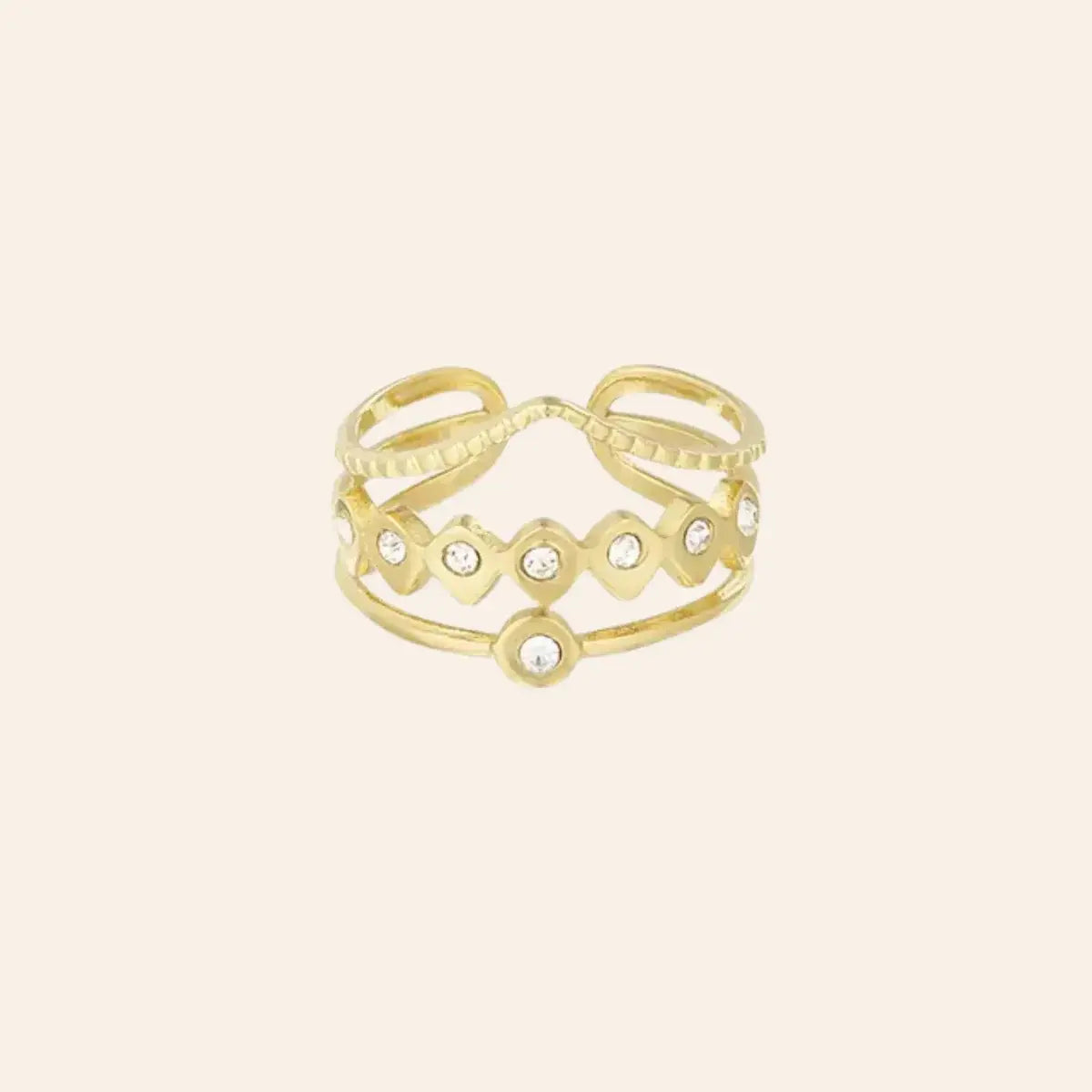 Bague Accra en acier inoxydable doré avec strass scintillants, design ajouré élégant.