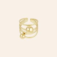 Bague ajustable dorée en acier inoxydable avec billes, design tendance et structuré.