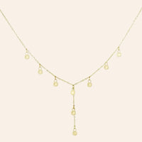 Collier Hanoï en acier inoxydable doré, pendentifs en forme de petits soleils rayonnants disposés en cascade sur une chaîne délicate, symbolisant l’élégance de la culture vietnamienne, présenté seul sur fond neutre.